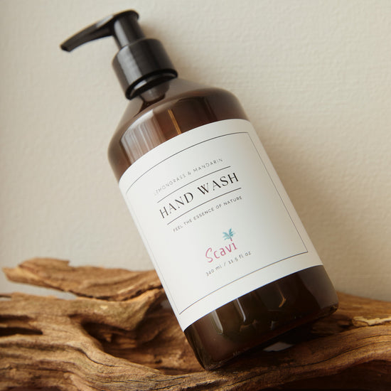 Hand wash bottle with pump on a wooden surface