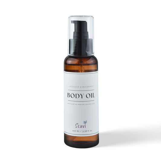 Body oil in a sleek pump bottle, set on a bright white background for a fresh and clean look